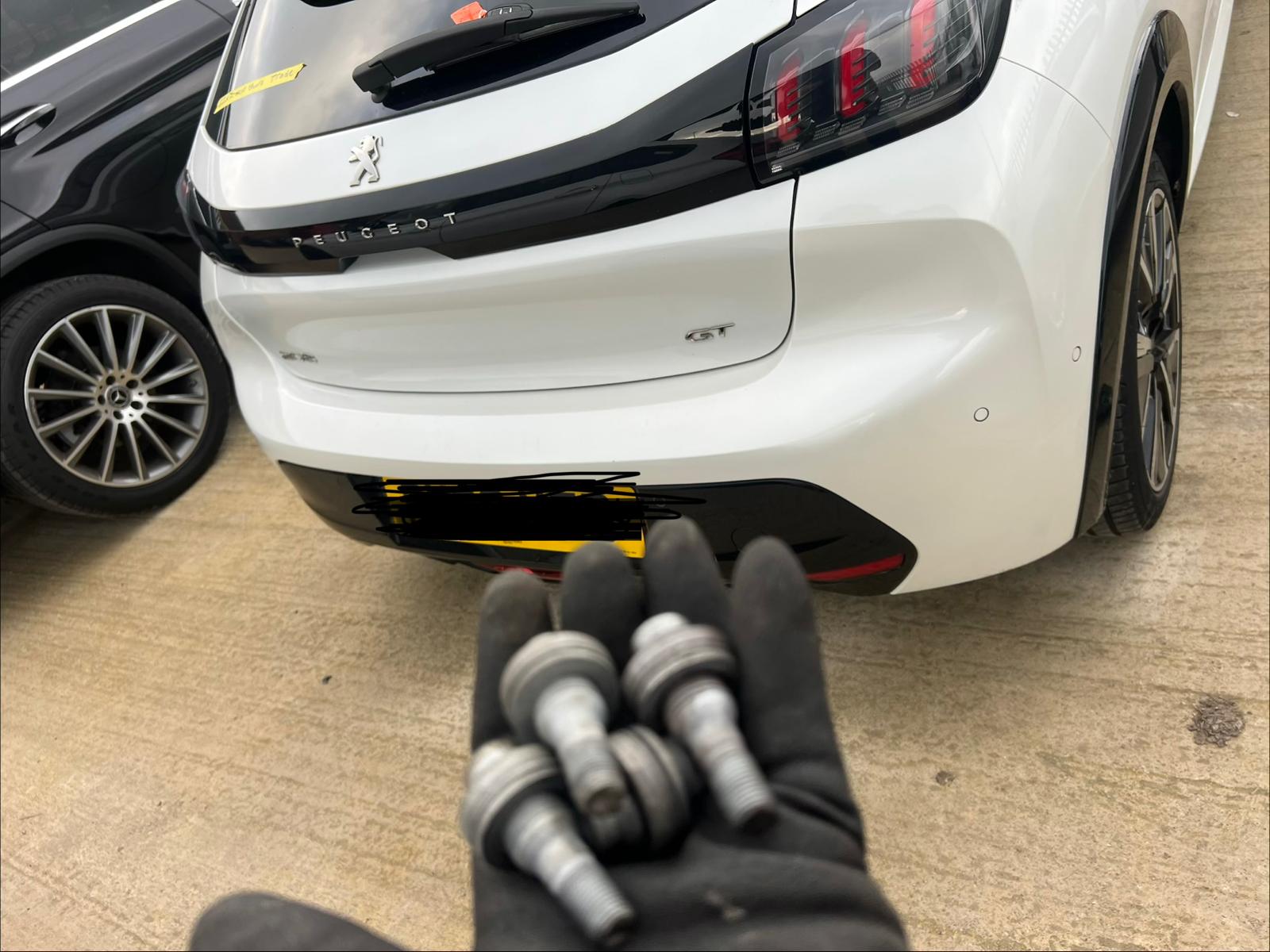 Professional locking wheel nut removal on an alloy wheel